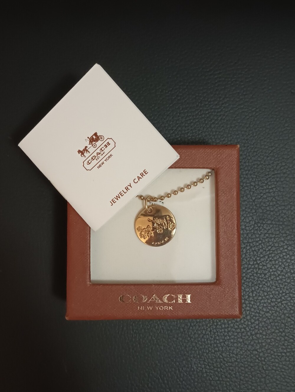 Coach horse and carriage gold tone disc pendant ball / chain necklace with box